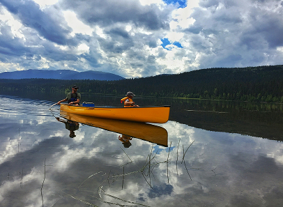 Orange canoe on lake